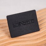 Wholesales Supplier Custom Logo Debossed Sew Garment Label PU Leather Laser Cut Washable Patches for Clothing and Bags Industry