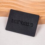 Wholesales Supplier Custom Logo Debossed Sew Garment Label PU Leather Laser Cut Washable Patches for Clothing and Bags Industry
