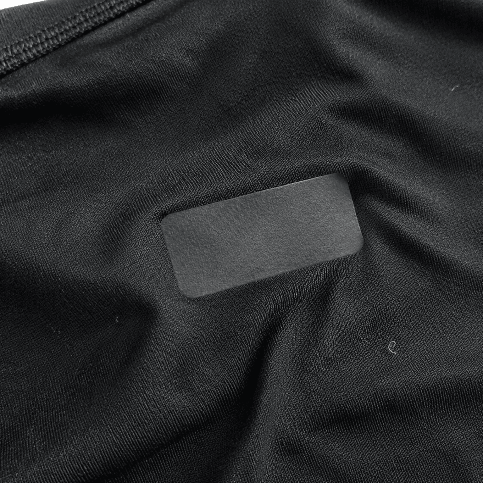 Heat transfer label applied to polyester activewear heat transfer labels on stretch activewear fabric