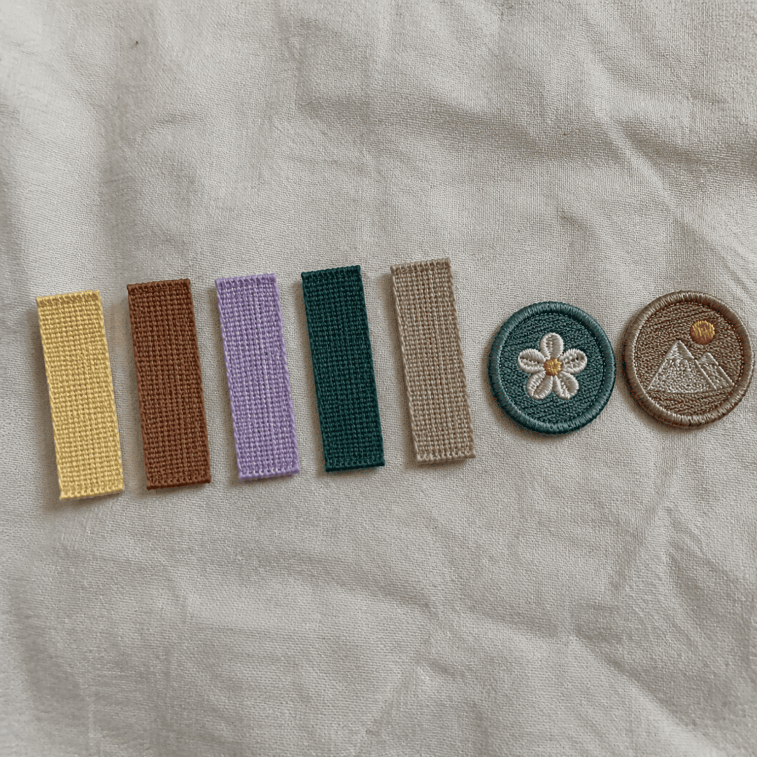 2026 textile color trend swatches applied to garment trims textile color trends 2026 trim swatches on woven labels and patches